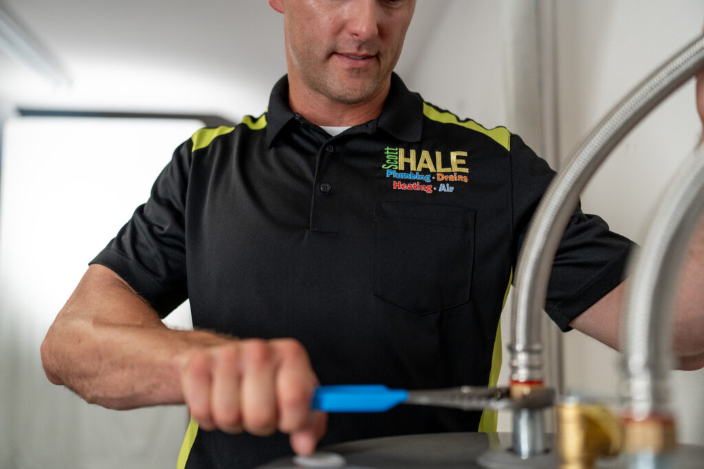 plumber installing a new hot water heater