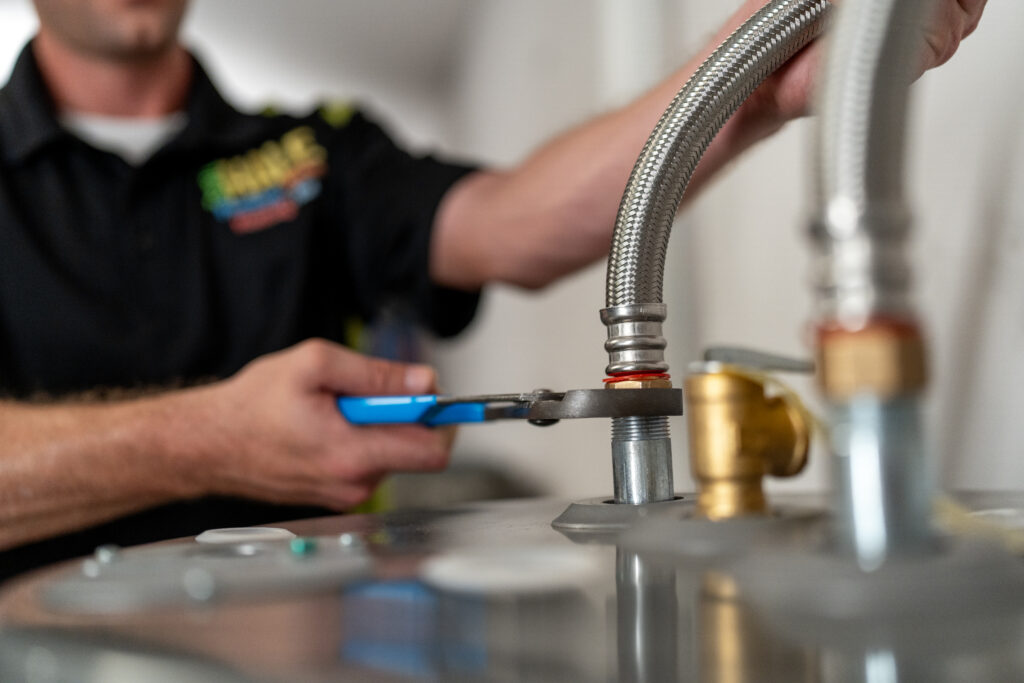 plumber installing a new hot water heater