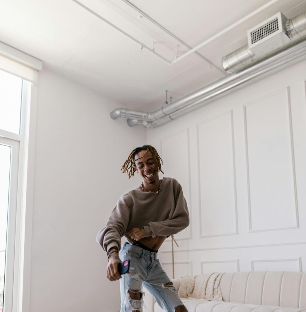 man dancing under exposed ductwork